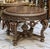 Make a dramatic statement with this grand, substantial French-style center table, designed with an exceptionally ornate...