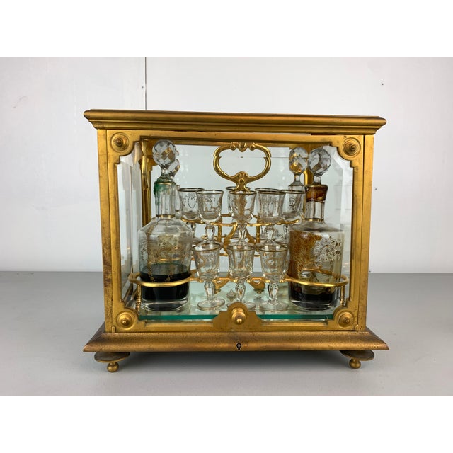 vintage brass liqueur glass cabinet with 4 liqueur bottles and 10 small liqueur sipping glasses. From the collection of...