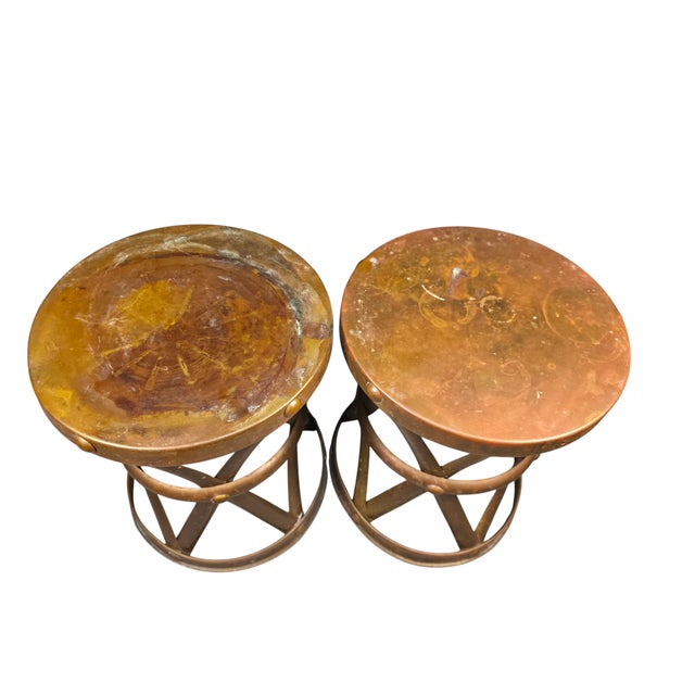 A sculptural pair of vintage brass X-form drum tables or taboret stools, circa 1970s, closely associated with designs...