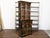 An English black lacquer secretary bookcase from the 19th century, with glass doors, drop-front desk and gold Chinoiserie...