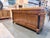 A distinguished sideboard by Baker Furniture from the Palladian Collection, executed in rich walnut with refined...