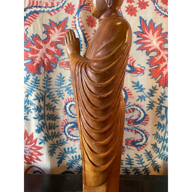 This is a beautifully hand carved buddha made of satinwood. The modest scale allows for a myriad of placement options. It...