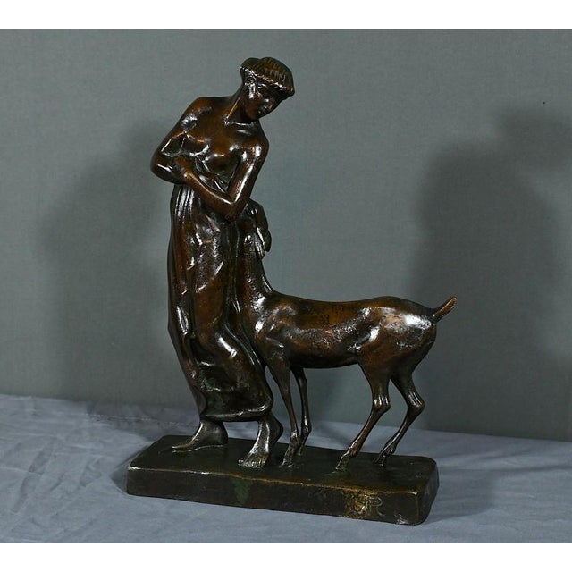 This bronze with brown patina entitled “La Femme au Fawn”, monogrammed and signed by the Primavera workshop, is an...