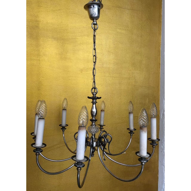 Elegant lighting set in a classic style, consisting of an impressive 8-arm chandelier and two 2-arm wall sconces. The...