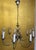 Elegant lighting set in a classic style, consisting of an impressive 8-arm chandelier and two 2-arm wall sconces. The...