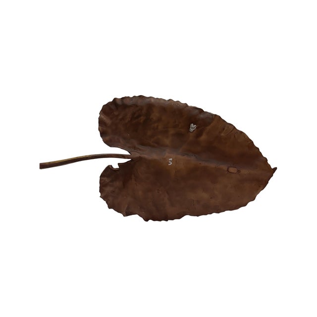 Crafted with meticulous detail, this wall art features lifelike veins and contours finished in a warm bronze tone. Its...