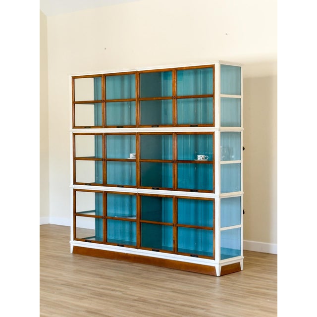 A striking architect bookcase, handcrafted by roche bobois, offered in its original condition. The bookcase is composed of...