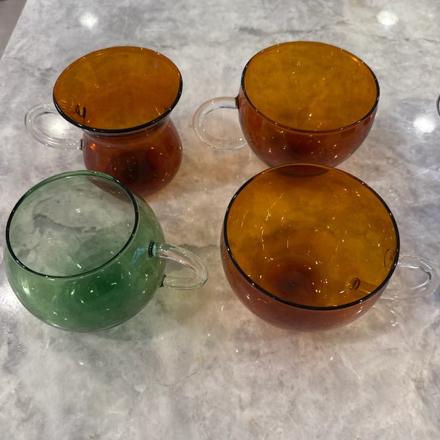 Different shapes and colors (green, blue, amber) of hand blown borosilicate glass coffee/tea cups Very light Can hold hot...
