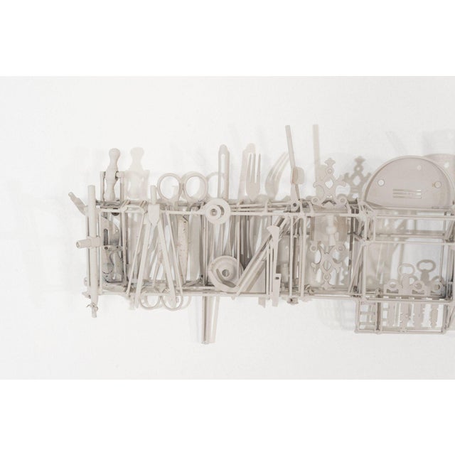 Max Neufeldt Metal Collage – Horizontal Assemblage Sculpture, 1990 This expansive, horizontally oriented metal collage is...