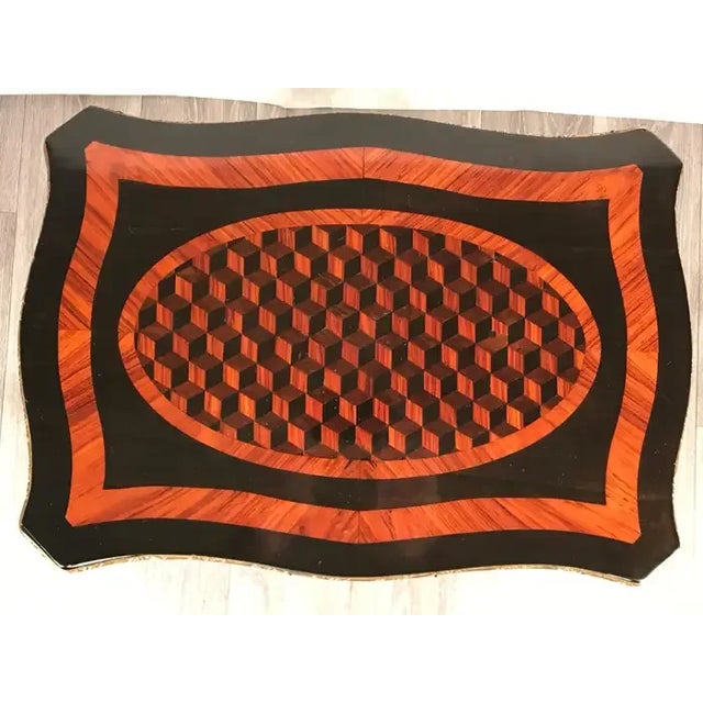 Napoleon III side table, France, 1860-1870. This unusual Napoleon III side table has an exquisite kingwood veneer and...