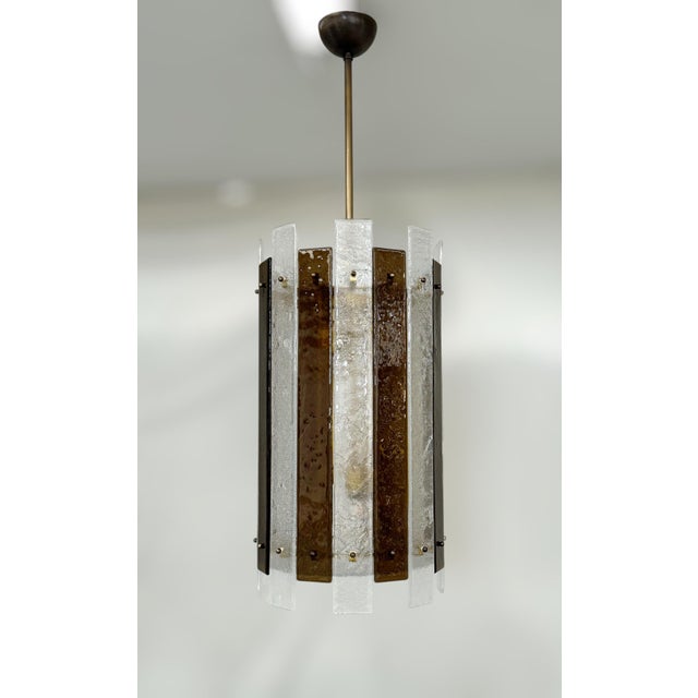 Modern Italian lantern with alternating textured clear and brown Murano glass planks and a round Murano bottom glass...