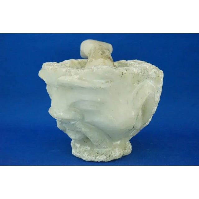 Description of the item: a wonderful anthropomorphic mortar, shaped like the face of an old asian man, with a pestle...