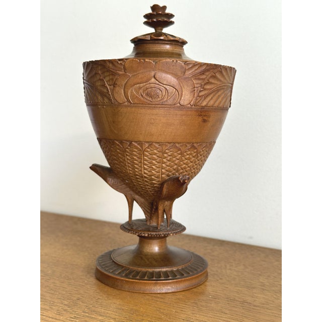 Antique covered urn or pot on a pedestal, made of finely carved fruitwood with floral and bird decoration. French work,...