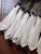 A set of 12 vintage mid-century silverplated butter knives with stainless steel blades from the Key Biscayne Hotel in...