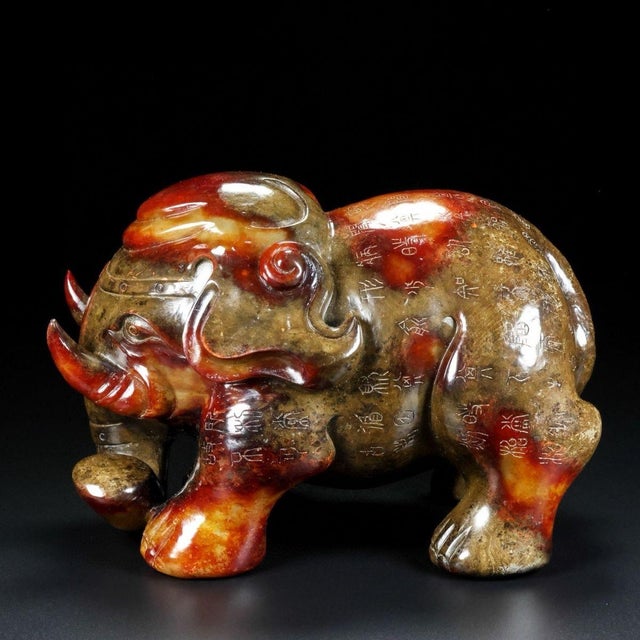 This impressive antique jade sculpture depicts a standing elephant, a traditional symbol of strength, wisdom, and good...