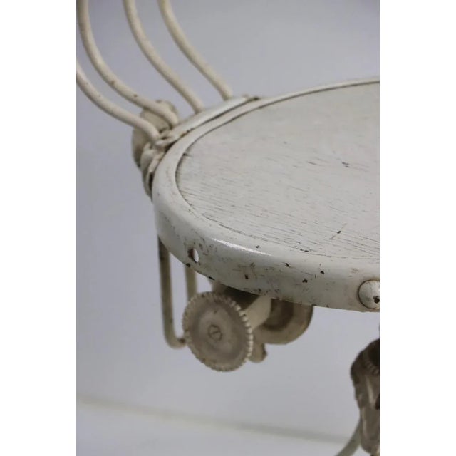 Unusual example of Industrial furniture, this stool is adjustable in height (Highest Position 37.5 x Lowest Position 30.25...