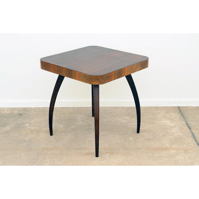 Walnut Spider Table H259 by Jindřich Halabala, 1950s, in Restored conditions. Designed 1950 to 1959 This piece is designed...