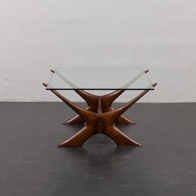 The vintage teak coffee table by Illum Wikkelsø for CF Christensen from 1960s showcases a stunning fusion of natural teak...