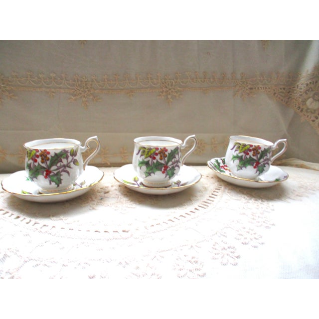 This is a Set of Three Royal Albert bone china Flower of the Month #12 Holly trio Hampton shape includes 3 teacups &...