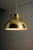 Substantial pendant light from the 1970s, features a classic mid-century dome silhouette. The shade is crafted from spun...