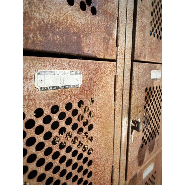 This 1950's solid steel metal Lyon's Gym Locker Set features 12 numbered cubby compartments, all with holes for natural...
