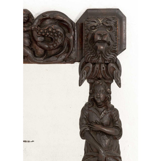German Renaissance Revival Carved Oak Framed Mirror, 19th century, with figural and lion masque carvings. Overall: 22.75"...