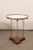 A French pair of oval side tables, with marble and brass gallery edge top, from the mid 20th century. These vintage tables...