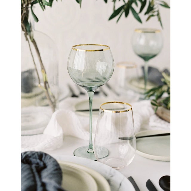 Set of 4 white wine goblets in Sage with gold rim. Sleek stem, bulbous mouth, 16 oz. Soft verdant green adds a nature-...
