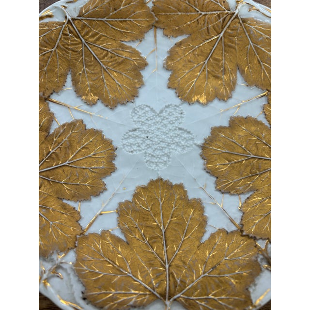 Absolutely lovely antique Meissen porcelain relief plate with textural gilded gold grape leaves.