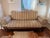 Antique Victorian carved walnut settee, professionally reupholstered in contemporary striped velvet with matching bolster...