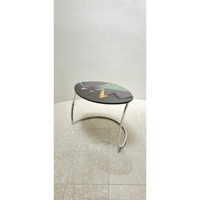 Carlo Malnati colorful and glossy inlay/wood marquetry table. Malnati signature visible on tabletop. Oval shape table top...