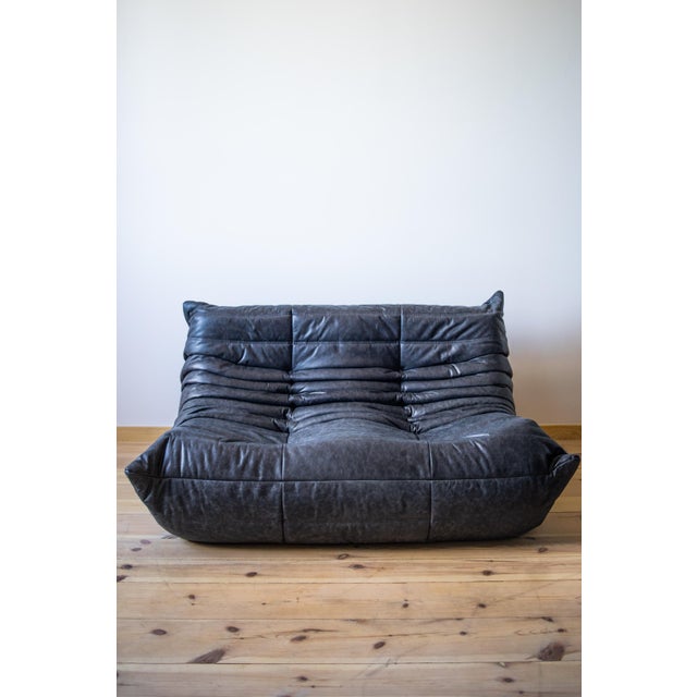 This togo living room set was designed by michel ducaroy in 1974 and was manufactured by ligne roset in france. It has...
