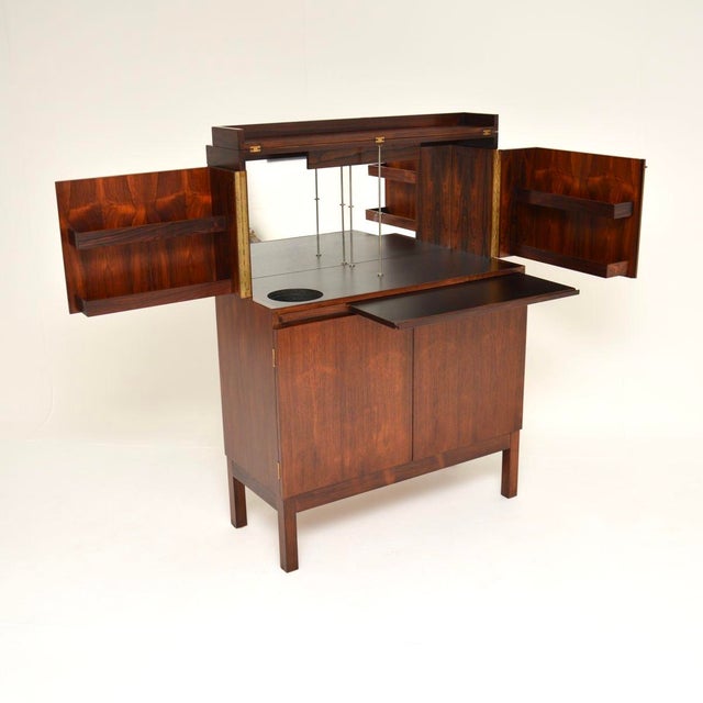 A stylish and extremely well made vintage Scandinavian Drinks Cabinet by Torbjorn Afdal. It was made in Norway by...