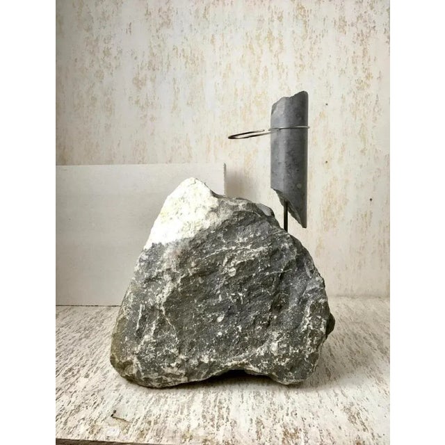 Blue stone flower vessel by studio do dimensions: d 40.5 x w 19 x h 48 cm materials: blue stone, stainless steel. 39 kg....