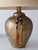 A handsome pair of vintage Chinoiserie-style table lamps featuring gilt ceramic vase-form bodies adorned with delicate...