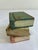 A vintage finds decorative accent full of storybook charm — this small stack of hand-painted wooden faux books features...