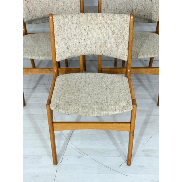 Exquisite set of six original Danish dining chairs, designed by renowned designer Erik Buch in the 1960s. These chairs are...