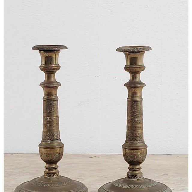 A pair of French Empire candlesticks, circa 1820.