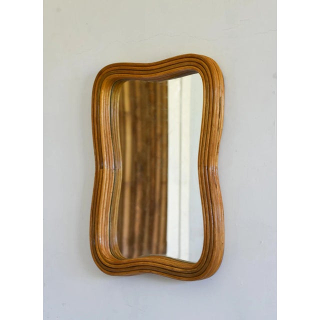 This beautifully crafted wall mounted mirror is made of pencil reed rattan, providing a unique and elegant texture. Its...