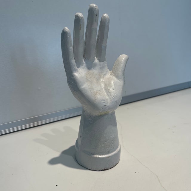 Metal and paint white accessory appropriate as a ring holder or Fun object to put on your table.