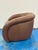 Stylish Modern Brown Leather Swivel Chair. Curved body. Showroom floor sample.
