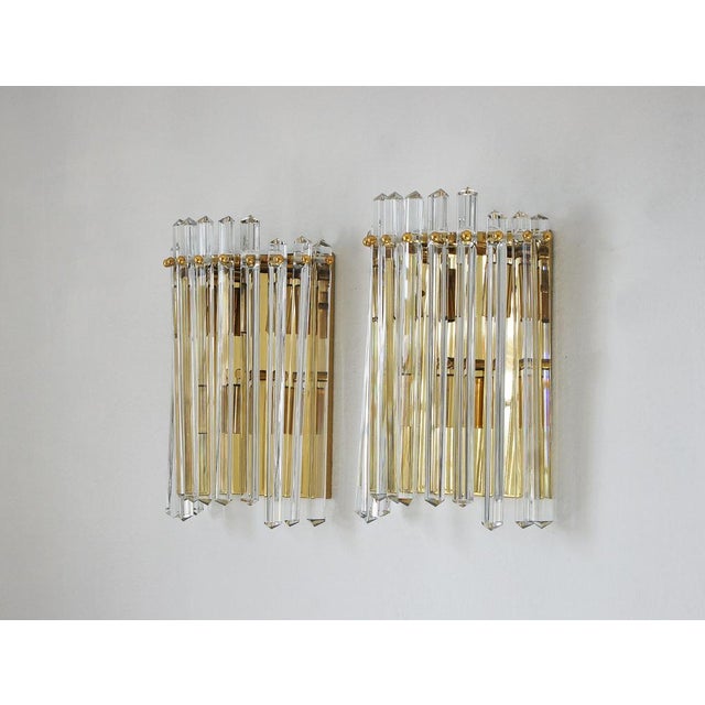 A pair of Italian Venini style wall sconces. The wall sconces stand out not only for their functionality, but also for...