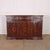 20th century Italian three drawer walnut sideboard with lovely carved door panels. 1920. This piece is designed in the...
