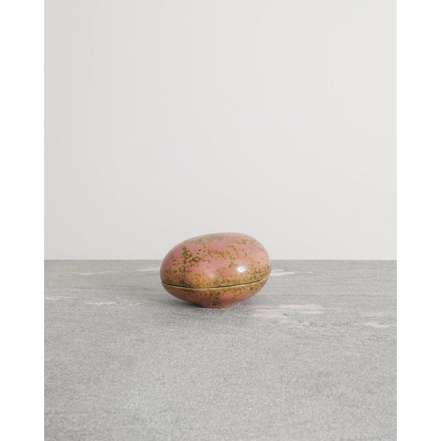 A rare and small decorative mid century pink and yellow glazed stoneware box with a green inside by the swedish ceramist...