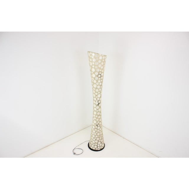 Made in czechoslovakia. Made of plastic and wood. There are defects on the surface of the lamp that cannot be cleaned. Dee...