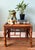 Handcrafted early to mid 20th-century Asian bamboo side table featuring a warm, beautifully aged finish and geometric...