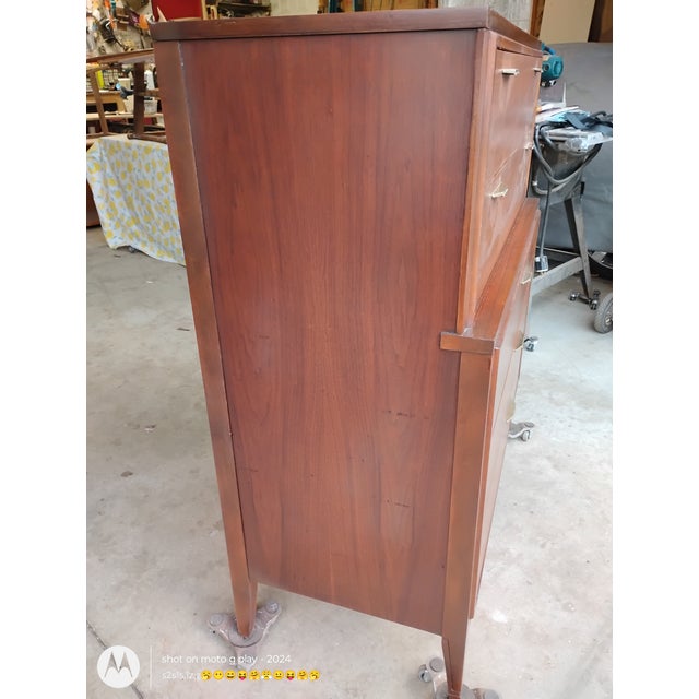 This is a mid century tallboy dresser in excellent condition. This was made by the Kent Coffey Furniture Co. It has been...