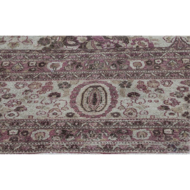 An heir to ancient tradition, this stunning Tabriz rug revels in its complex and beautiful design. Using a floral motif,...