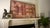 A striking large-scale framed textile wall hanging by Loloi, professionally presented as a substantial piece of decorative...