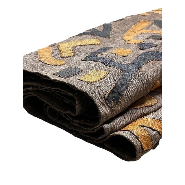 This is an old Itum cloth worn by younger women at wedding ceremonies Kuba cloth, the result of a laborious process...